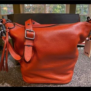 Ladies Pebbled leather, coach duffel, adjustable shoulder strap, brand new